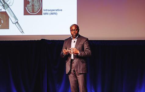 UCSF neurosurgeon Shawn Hervey-Jumper, MD, on stage at the BrainMind Summit