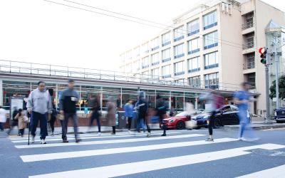 People at a busy crosswalk on the UCSF Parnassus Campus