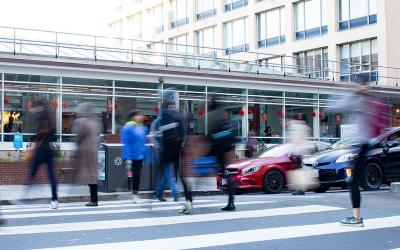 People at a busy crosswalk on the UCSF Parnassus Campus