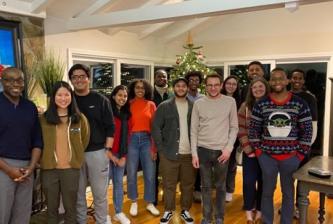 Hervey-Jumper lab standing in front of a Christmas tree